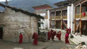 FILE - Tibetan nuns walk through the grounds of the Taibaling Nunnery at Shusong Village, in the mountains about 50 kilometers (31 miles) from the border with Tibet, in China's southwest Yunnan province Tuesday March 25, 2008. The nunnery was rebuilt on the site of a 300-year-old monastery after the monastery and the nearby nunnery were destroyed during China's 1966-76 Cultural Revolution. Some 130 Tibetan nuns currently study at the nunnery.